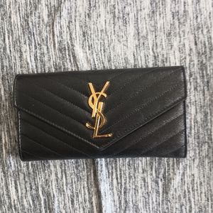 Yves saint Laurent flap wallet with card.